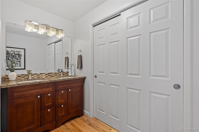 bathroom featuring vanity and wood-type flooring