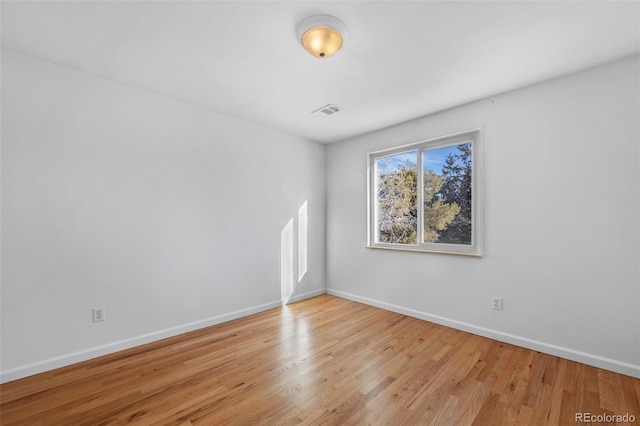 unfurnished room featuring light wood-type flooring