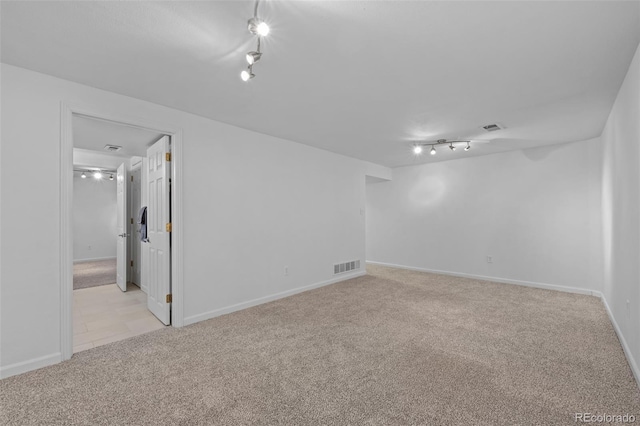 unfurnished room with light colored carpet