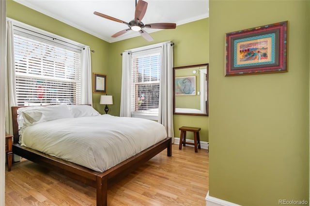 1301 N Ogden St Unit 1A, Denver, CO 80218 - bedroom with crown molding, light wood finished floors, a baseboard heating unit, and ceiling fan