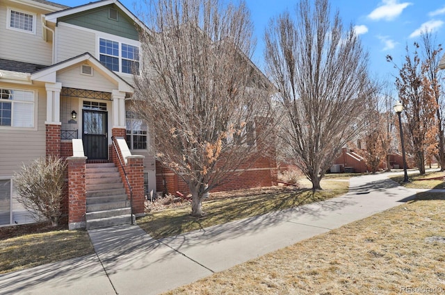 view of front of property with brick siding