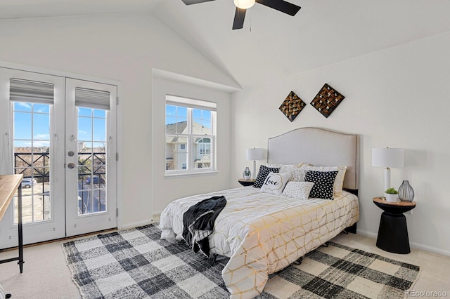 carpeted bedroom featuring lofted ceiling, access to exterior, multiple windows, and french doors