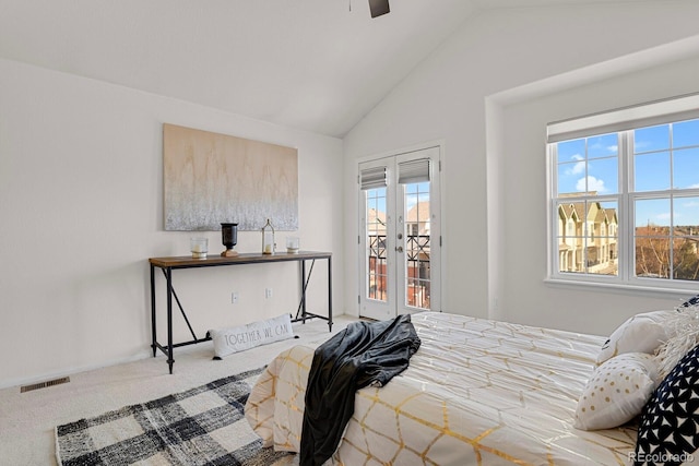 carpeted bedroom featuring access to exterior, french doors, visible vents, a ceiling fan, and vaulted ceiling