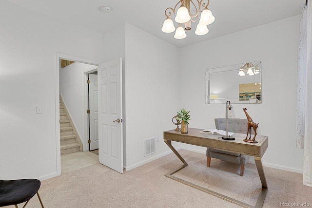 office featuring carpet flooring, visible vents, and baseboards