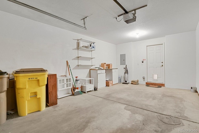 garage with electric panel and a garage door opener