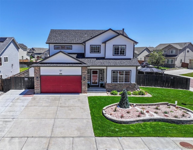 9455 Shinnecock Ct, Peyton, CO 80831 - view of front of house featuring concrete driveway, a residential view, a garage, and roof with shingles