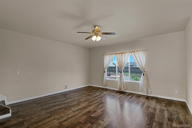 9455 Shinnecock Ct, Peyton, CO 80831 - spare room with a ceiling fan, dark wood-type flooring, baseboards, and a textured ceiling