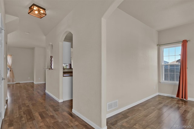 9455 Shinnecock Ct, Peyton, CO 80831 - entryway featuring arched walkways, wood finished floors, and baseboards