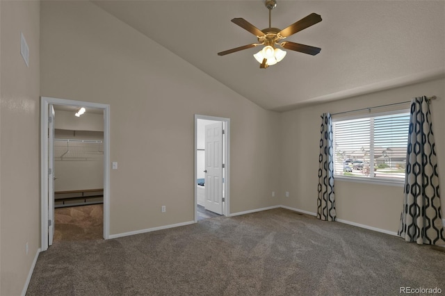 9455 Shinnecock Ct, Peyton, CO 80831 - unfurnished bedroom featuring carpet flooring, a spacious closet, baseboards, ensuite bath, and high vaulted ceiling