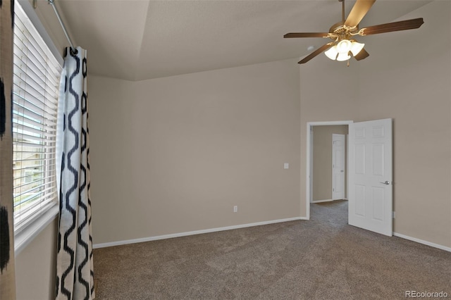 9455 Shinnecock Ct, Peyton, CO 80831 - spare room with carpet floors, ceiling fan, baseboards, and high vaulted ceiling