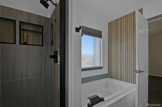 9455 Shinnecock Ct, Peyton, CO 80831 - bathroom featuring a garden tub and tiled shower
