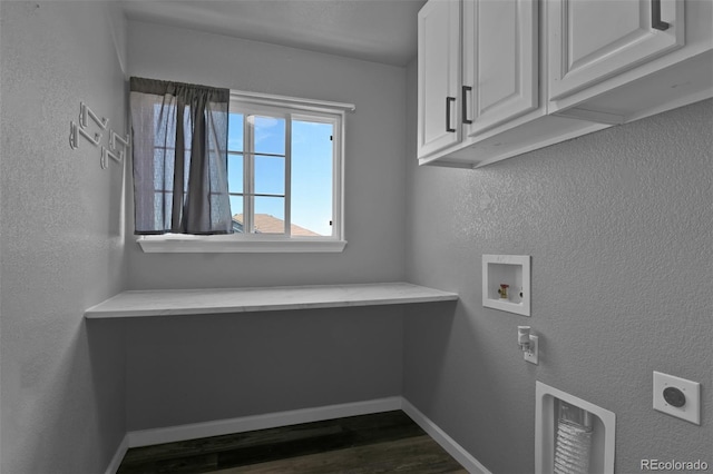 9455 Shinnecock Ct, Peyton, CO 80831 - washroom with cabinet space, hookup for a washing machine, dark wood finished floors, electric dryer hookup, and baseboards