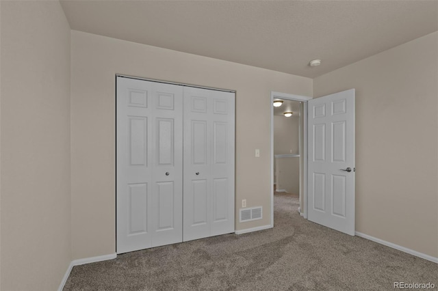 9455 Shinnecock Ct, Peyton, CO 80831 - unfurnished bedroom with carpet floors, baseboards, and a closet