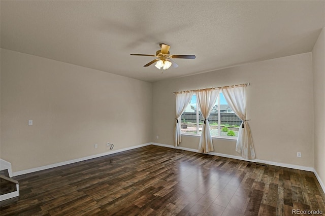 9455 Shinnecock Ct, Peyton, CO 80831 - empty room with ceiling fan, dark wood finished floors, baseboards, and a textured ceiling