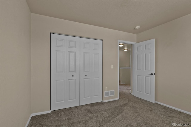 9455 Shinnecock Ct, Peyton, CO 80831 - unfurnished bedroom featuring carpet flooring, baseboards, and a closet