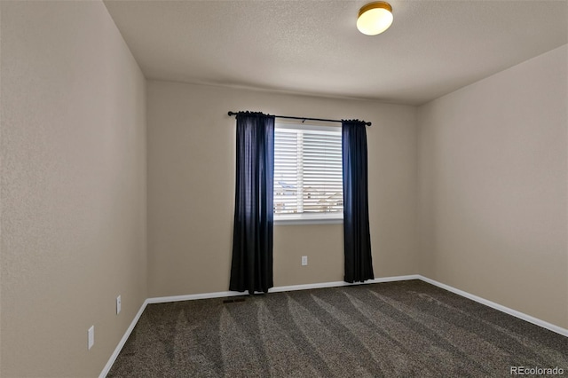 9455 Shinnecock Ct, Peyton, CO 80831 - empty room with dark colored carpet and baseboards