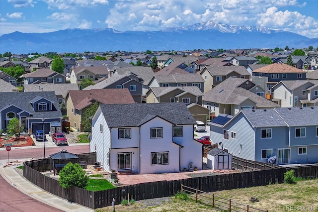 9455 Shinnecock Ct, Peyton, CO 80831 - aerial perspective of suburban area with a mountain backdrop