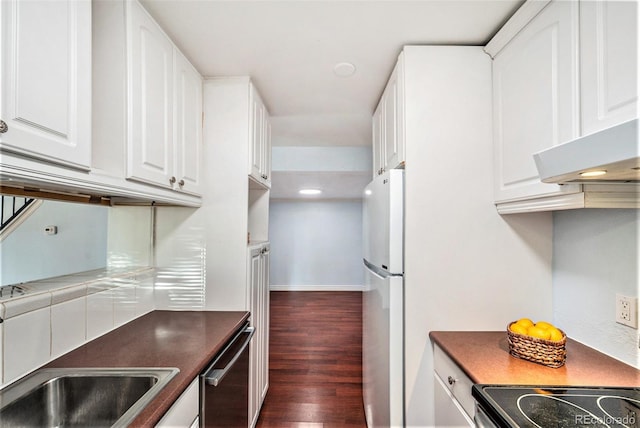 kitchen with white cabinetry, sink, dark hardwood / wood-style flooring, white fridge, and stainless steel dishwasher