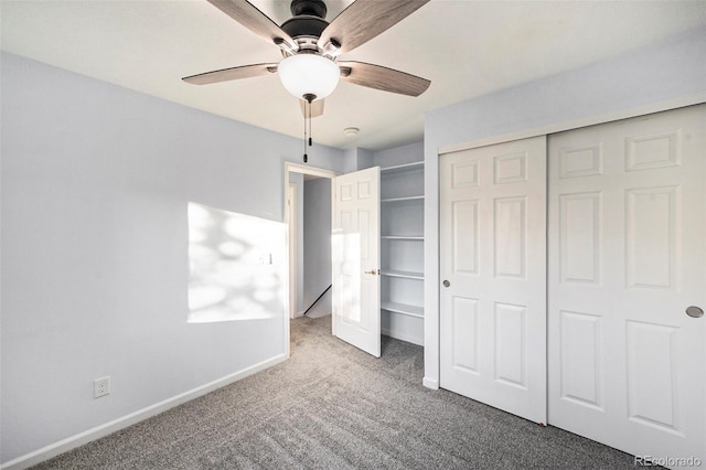 unfurnished bedroom featuring light colored carpet, ceiling fan, and a closet