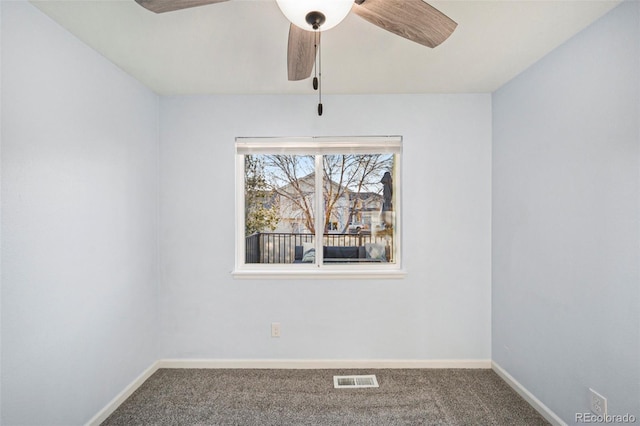 carpeted empty room with ceiling fan