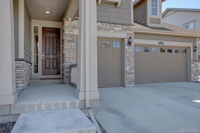 doorway to property featuring a garage