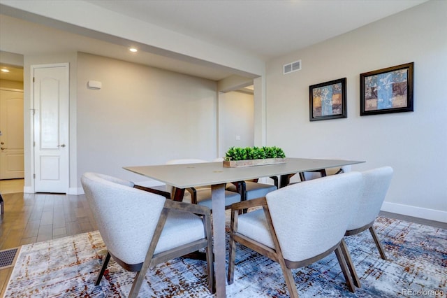 dining area featuring hardwood / wood-style flooring