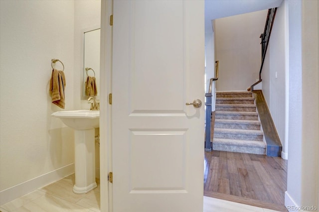 stairway with wood-type flooring