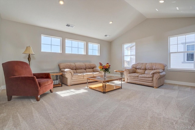 living room featuring vaulted ceiling and light colored carpet