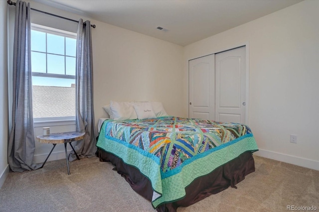 carpeted bedroom featuring a closet