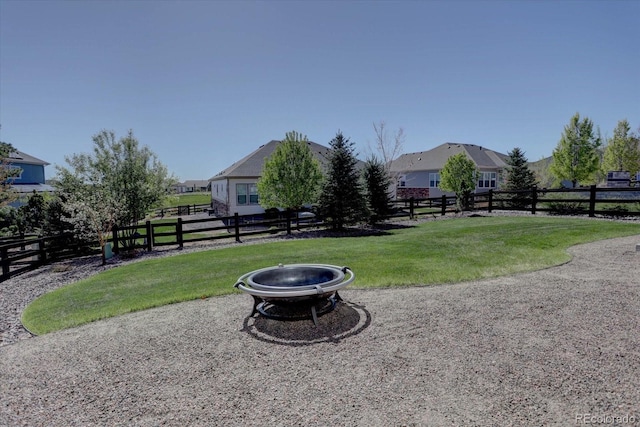 view of yard featuring a patio and an outdoor fire pit