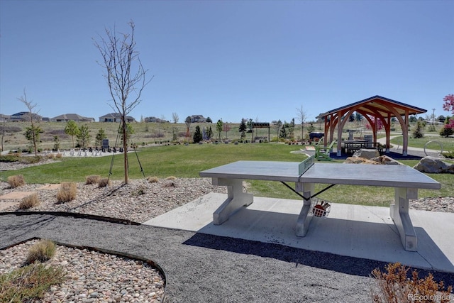 view of property's community with a gazebo and a yard