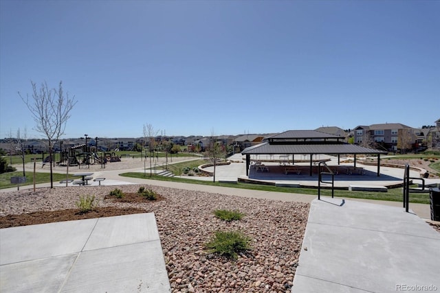 view of yard featuring a gazebo and a playground