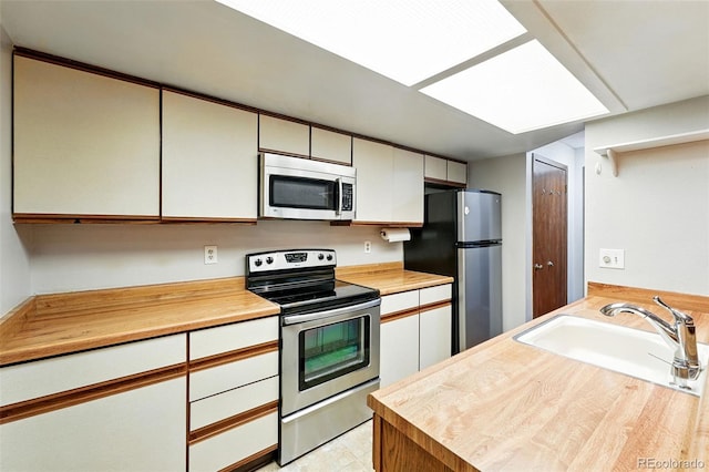 2960 Shadow Creek Dr Unit 201, Boulder, CO 80303 - kitchen featuring stainless steel appliances and white cabinetry