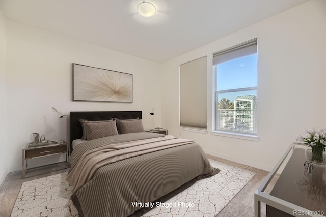 bedroom with carpet flooring and baseboards