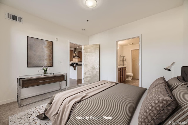 1313 S Clarkson St Unit 205, Denver, CO 80210 - bedroom featuring carpet floors, ensuite bath, and baseboards