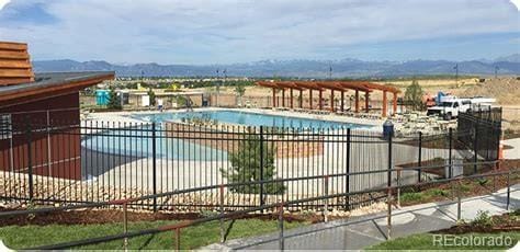 722 Eva Peak Dr, Erie, CO 80516 - community pool featuring a mountain view