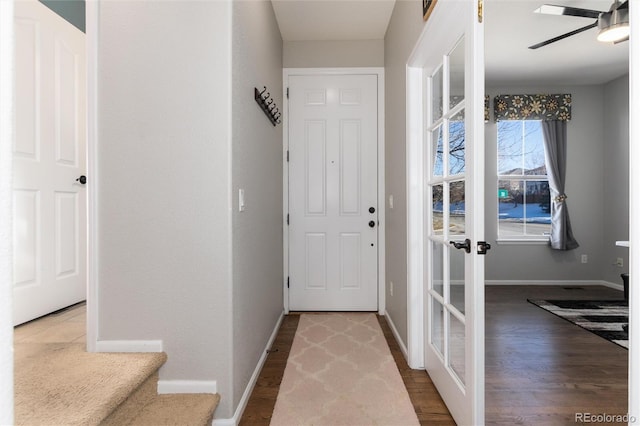 entryway with ceiling fan, french doors, and wood-type flooring