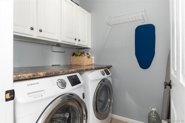 laundry room with cabinets and independent washer and dryer