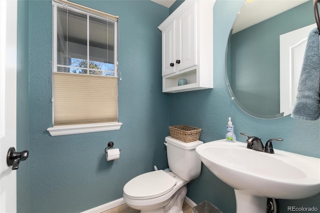 bathroom with toilet and sink