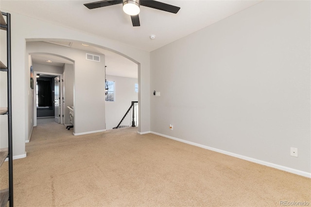 carpeted empty room with ceiling fan