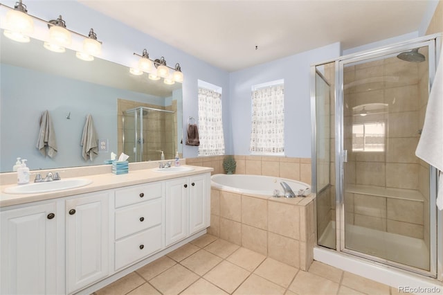 bathroom with vanity, tile patterned flooring, and independent shower and bath