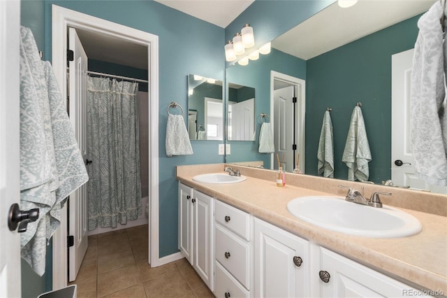 bathroom with tile patterned floors and vanity