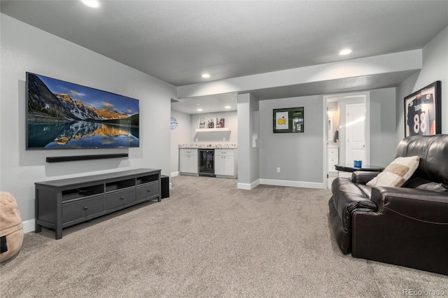 living room with beverage cooler, bar, and carpet flooring