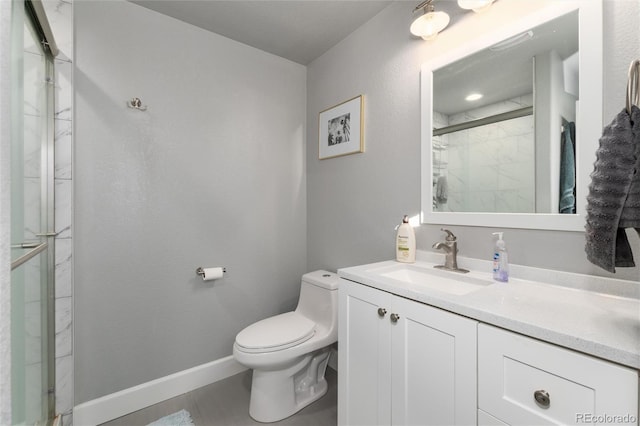 bathroom with vanity, toilet, and an enclosed shower