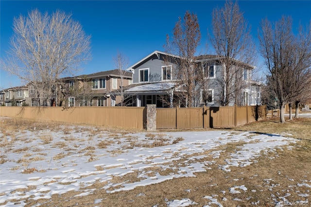 view of snow covered property