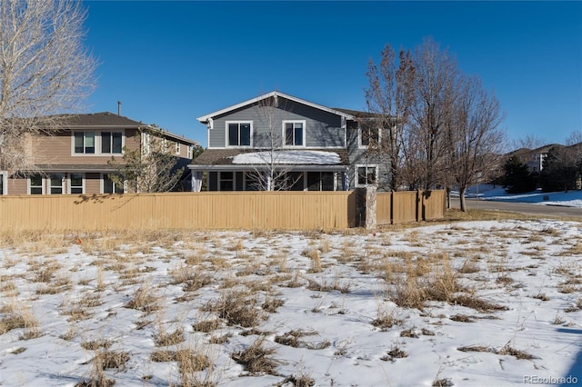 view of snow covered property