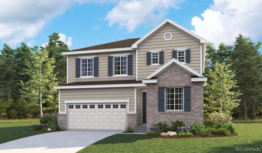 view of front of home with a garage and a front lawn