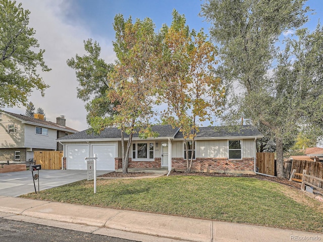 view of front facade with a front yard and a garage