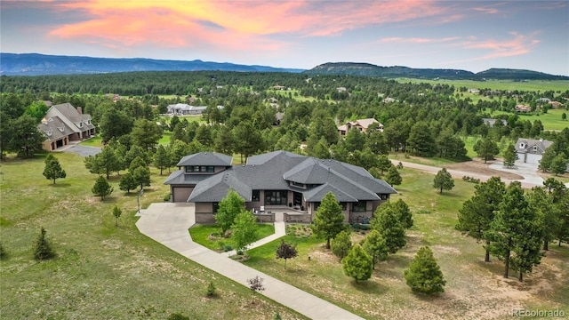 843 Long Timber Ln, Monument, CO 80132 - aerial view at dusk of a view of trees and a mountain view