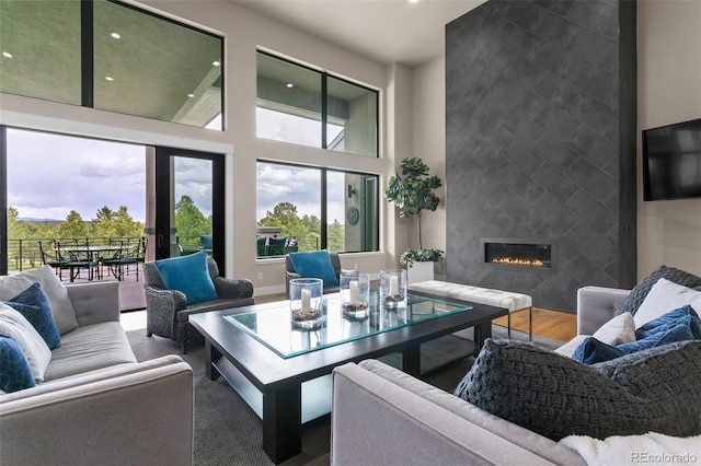 843 Long Timber Ln, Monument, CO 80132 - living area with recessed lighting, a towering ceiling, and a tiled fireplace